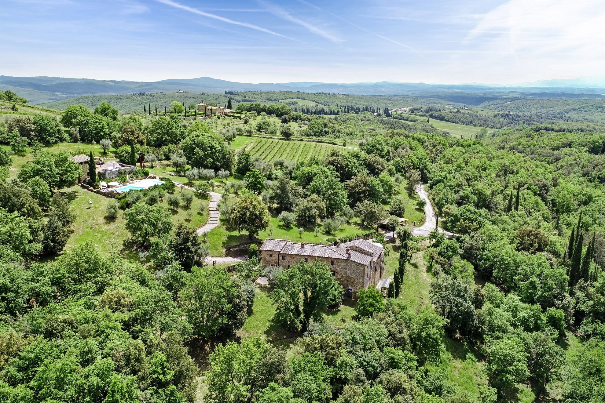 Chiusarella, the aerial view of villa, annex with pool and garden