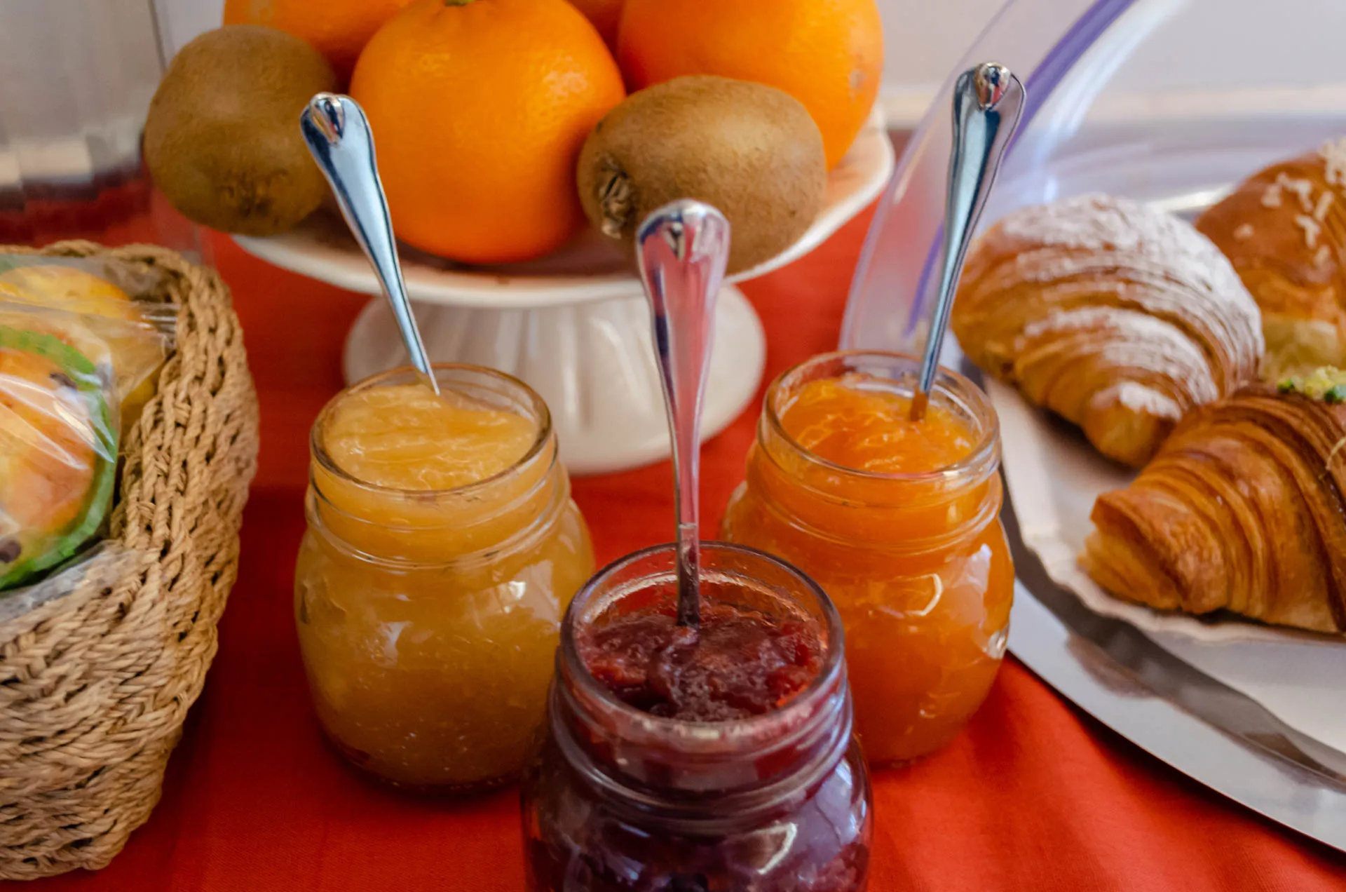 Selection of homemade jams and fresh pastries for breakfast