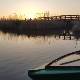 typical wooden boat in the massaciuccoli lake during sunset