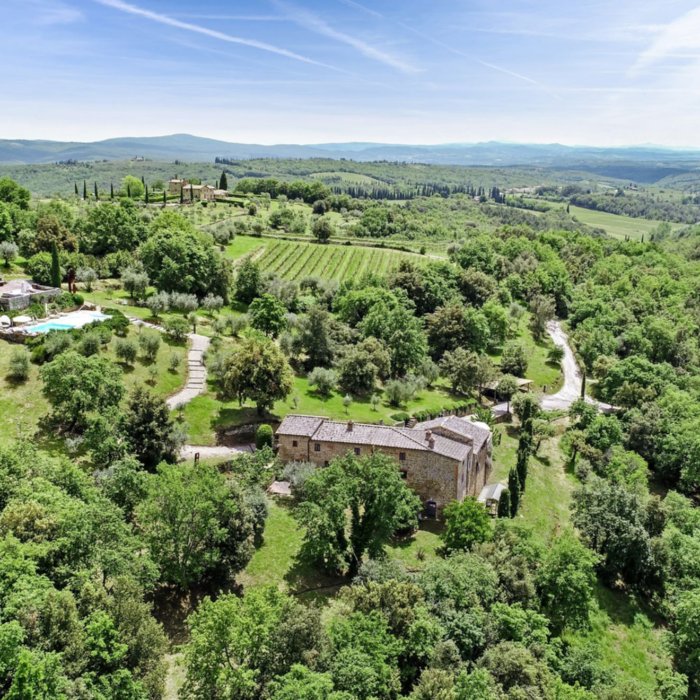 Chiusarella, the aerial view of villa, annex with pool and garden