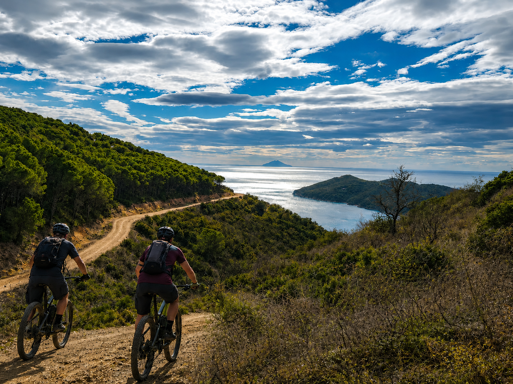 Cyclists and view over coastal gulf