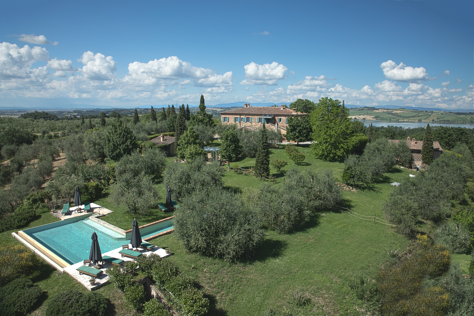 View of Poggio Pilella from above where you can see the farmhouse and the swimming pool