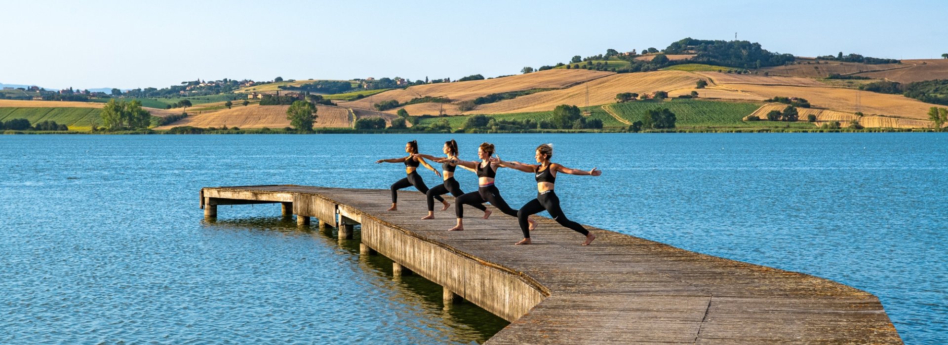 Yoga lesson and picnic on the shore of the lake of the Etruscans