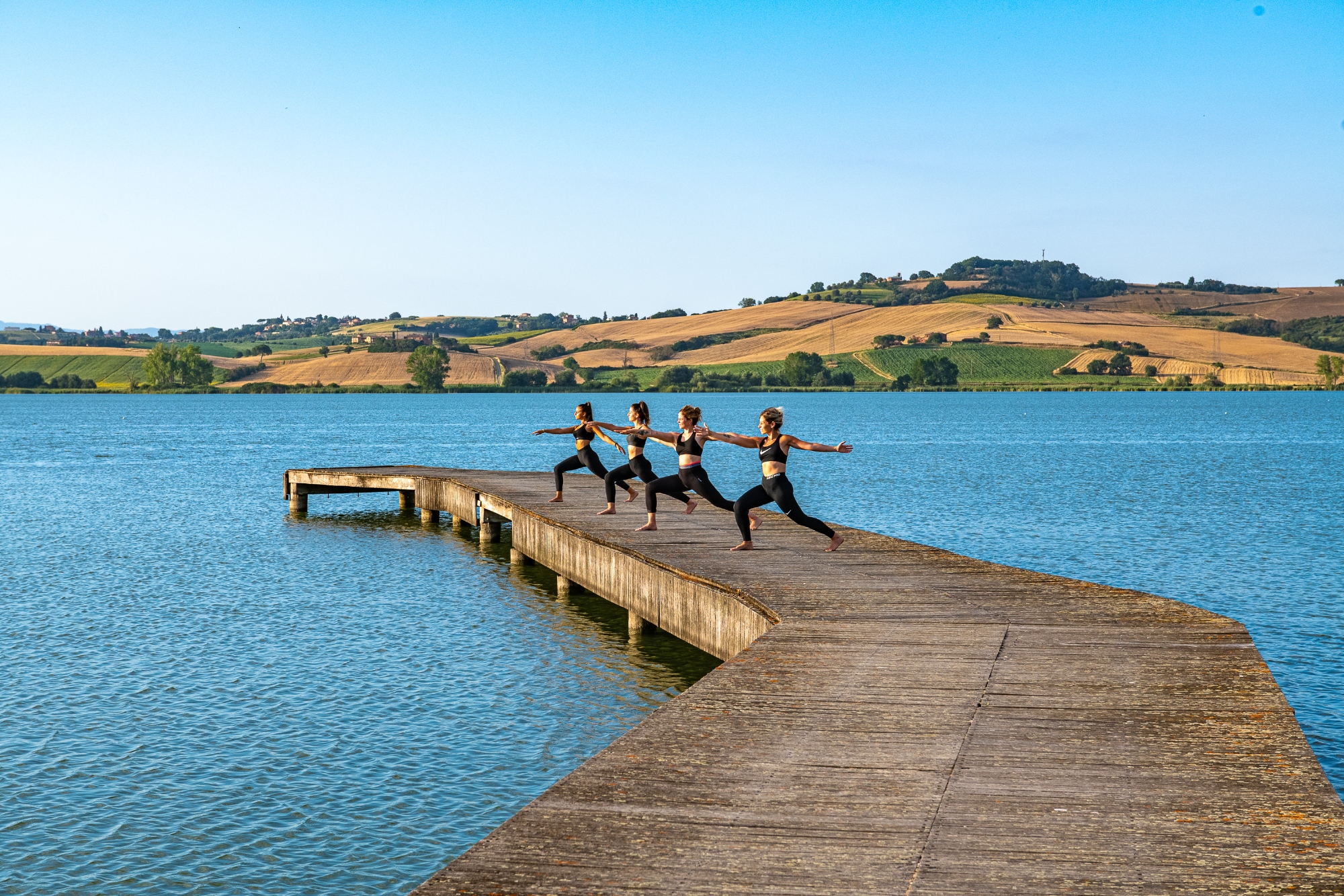 Yoga lesson and picnic on the shore of the lake of the Etruscans