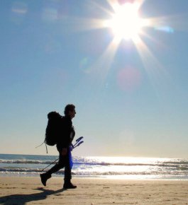 man-walking-on-the-beach-in-camaiore