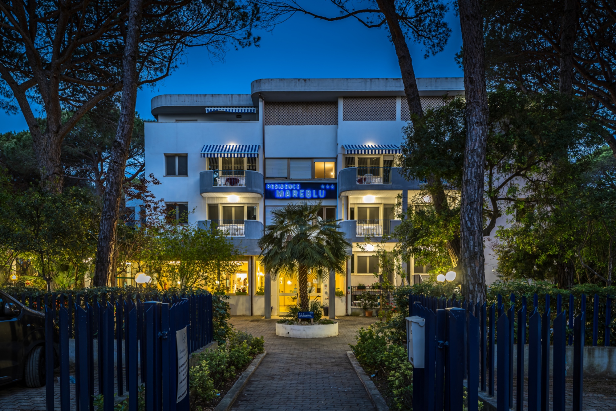 Residence entrance with tress all around