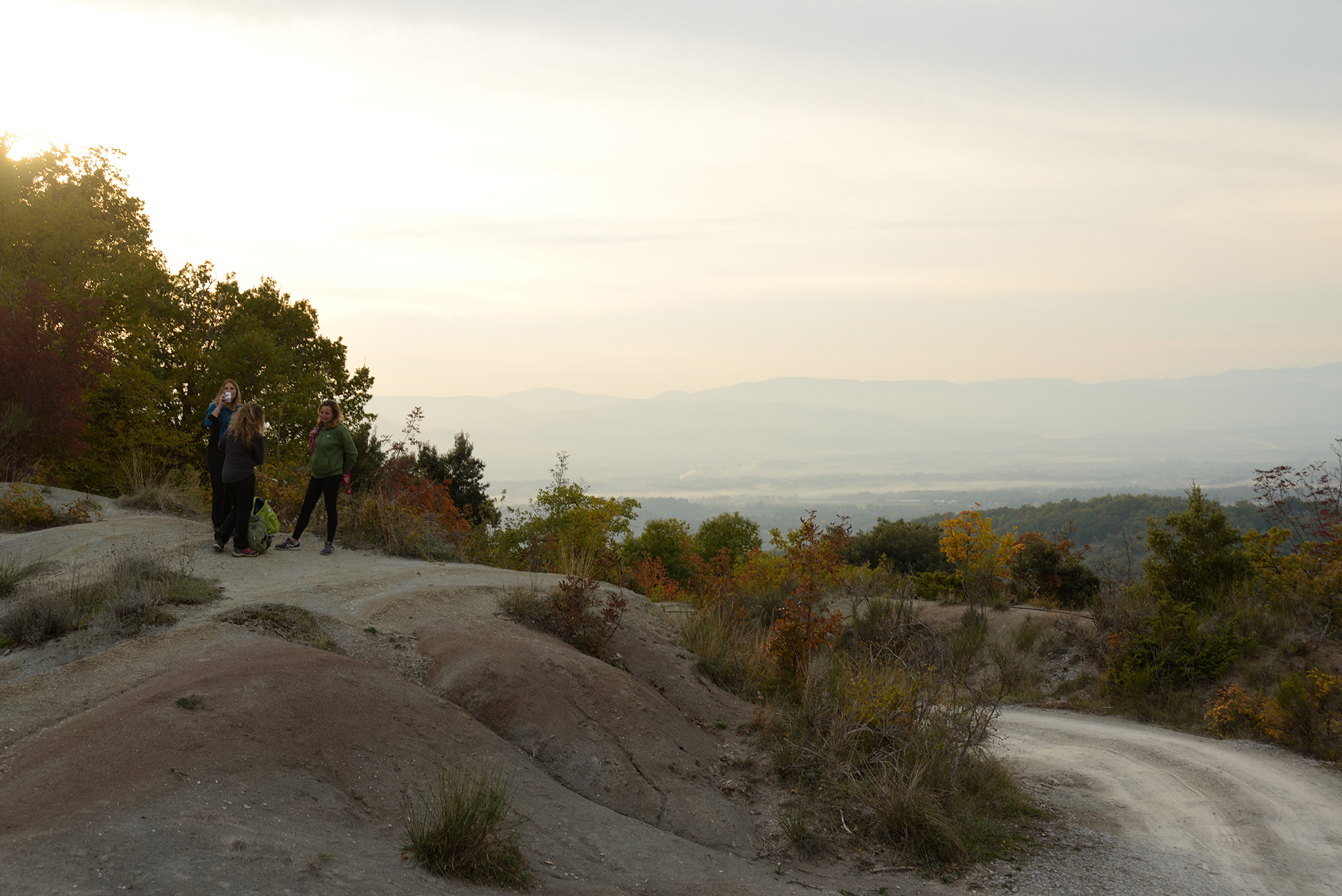 A trekking route at sunset immersed in the nature of the Tuscan Apennines