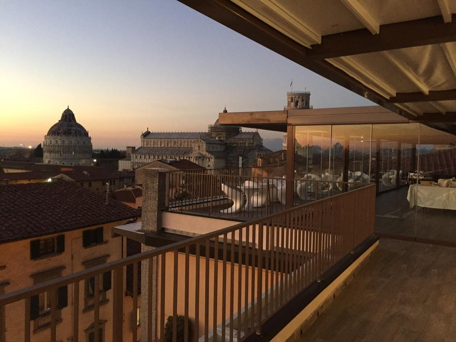 Enjoy the pleasant sensation of a wine tasting while admiring the scenery of Piazza dei Miracoli at sunset