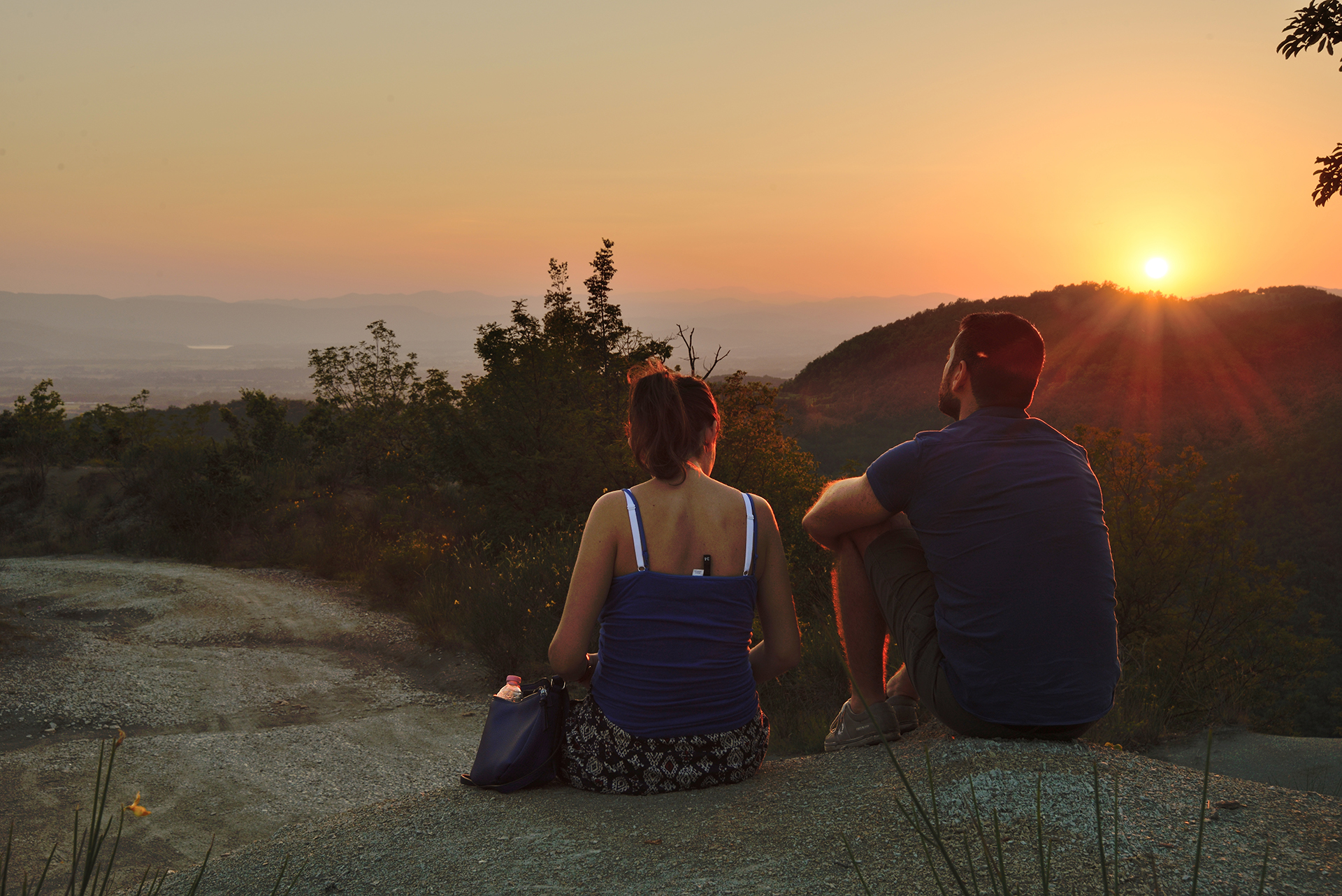 A trekking route at sunset immersed in the nature of the Tuscan Apennines