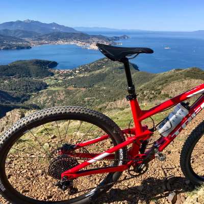 A bicycle in the foreground, Elba Island in the background A bicycle in the foreground, Elba Island in the background
