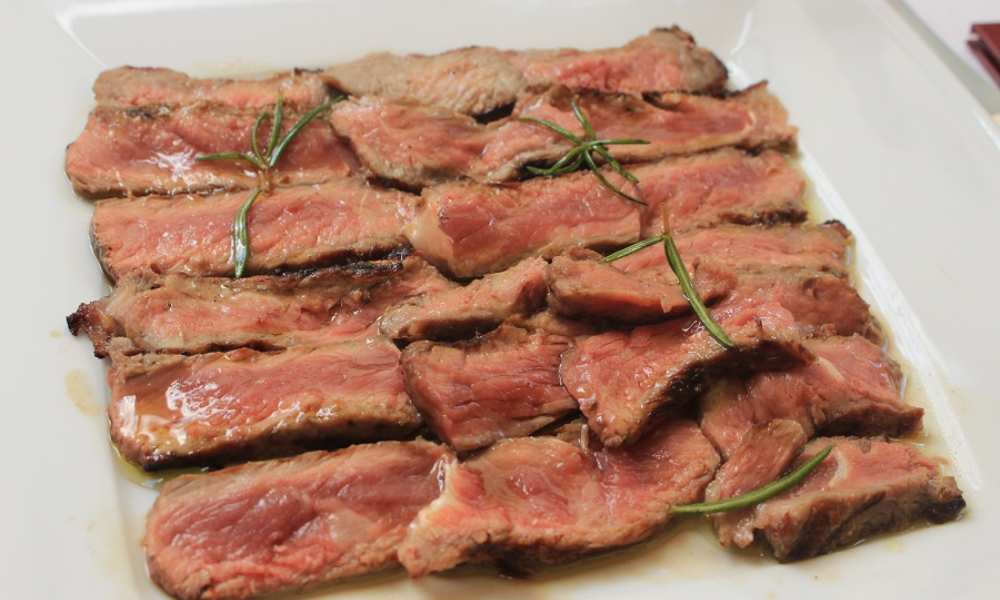 Tagliata beef seasoned with rosemary and extra virgin olive oil