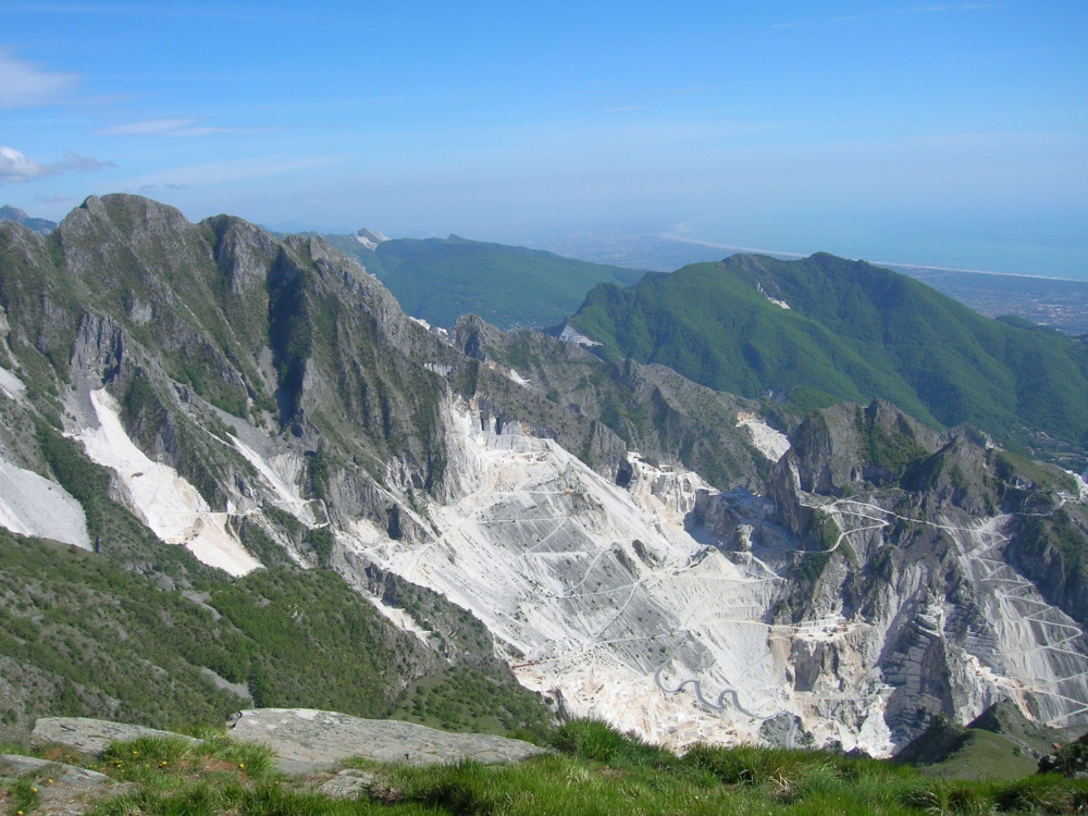 Carrara Marble quarries in the Apuan Alps, with the sea in the background